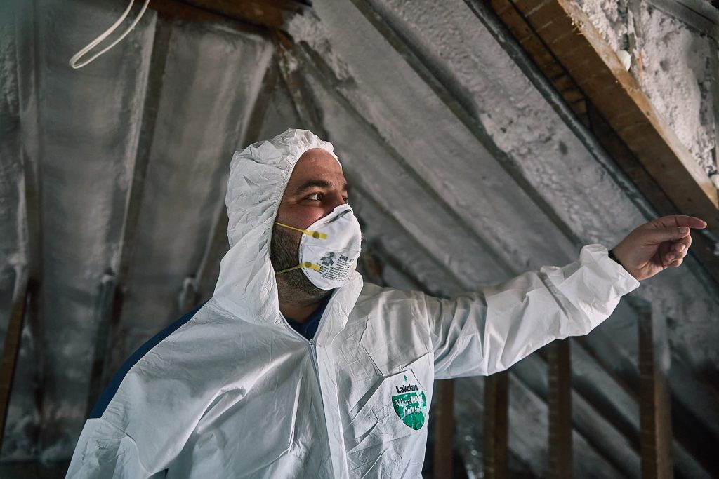 Person working attic insulation